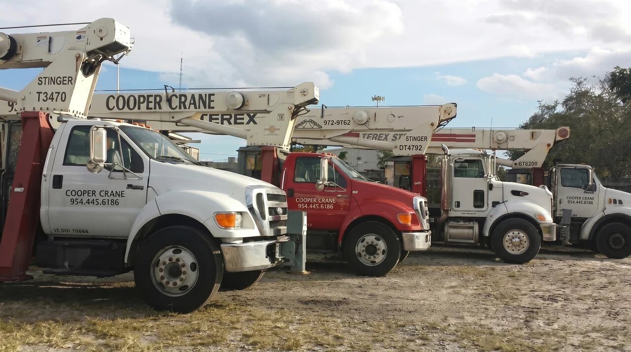 Cooper Crane boom trucks lined up at the West Park yard